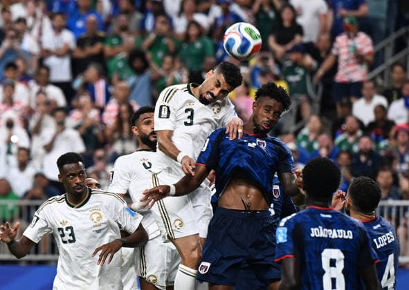 (260627) -- HOUSTON, June 27, 2026 -- Ali Lajami (top) of Saudi Arabia jumps for a head ball during the group H match between Cabo Verde and Saudi Arabia at the 2026 FIFA World Cup, WM, Weltmeisterschaft, Fussball at Houston Stadium in Houston, the United States, June 26, 2026. ) (SP)U.S.-HOUSTON-FOOTBALL-FIFA WORLD CUP-GROUP H-CPV VS KSA XiaoxYijiu 