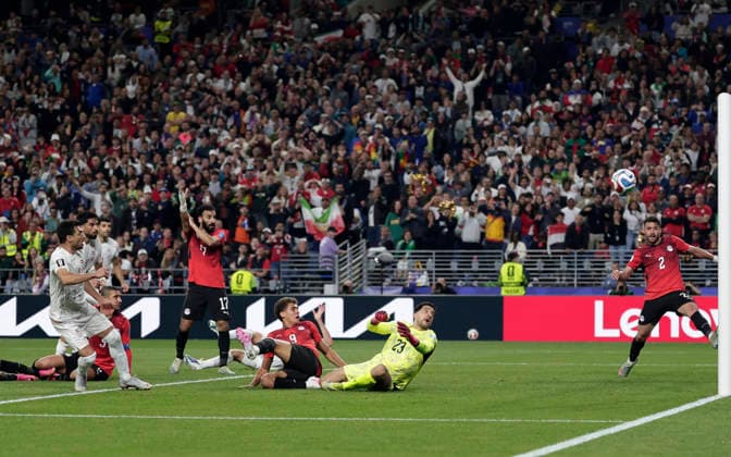 (260627) -- SEATTLE, June 27, 2026 -- Egypt s goalkeeper Mohamed ElShenawy (2nd R) fails the save the goal by Shoja Khalilzadeh (1st L) of Iran during the group G match between Egypt and Iran at the 2026 FIFA World Cup, WM, Weltmeisterschaft, Fussball at Seattle Stadium in Seattle, the United States, June 26, 2026. (Photo by Xinhua) (SP)U.S.-SEATTLE-FOOTBALL-FIFA WORLD CUP-GROUP G-EGY VS IRN ArthurxDong 