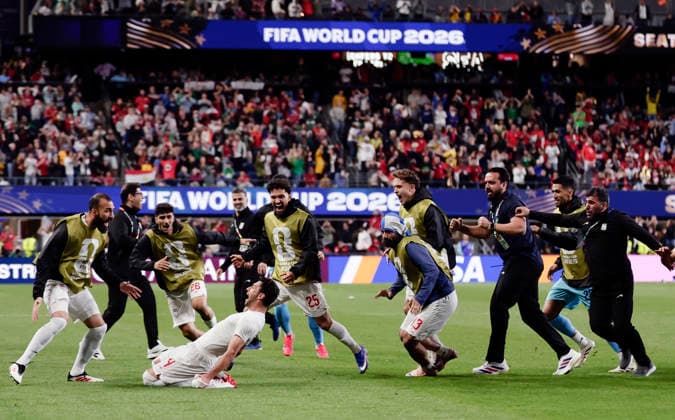 (260627) -- SEATTLE, June 27, 2026 -- Members of Iran celebrate a goal by Shoja Khalilzadeh (bottom) that is later disallowed during the group G match between Egypt and Iran at the 2026 FIFA World Cup, WM, Weltmeisterschaft, Fussball at Seattle Stadium in Seattle, the United States, June 26, 2026. (Photo by Xinhua) (SP)U.S.-SEATTLE-FOOTBALL-FIFA WORLD CUP-GROUP G-EGY VS IRN ArthurxDong 