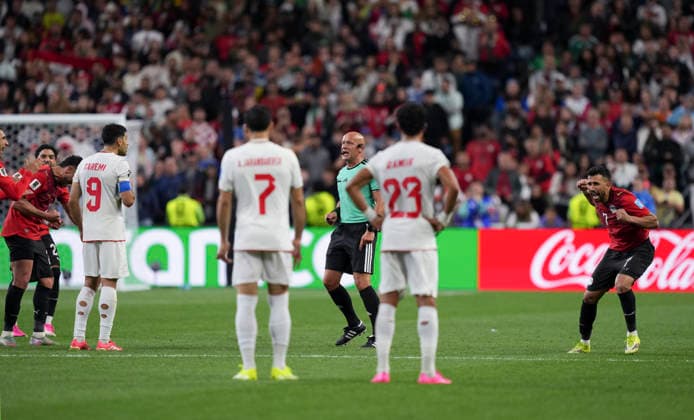 (260627) -- SEATTLE, June 27, 2026 -- Referee Szymon Marciniak (C) disallows the goal by Iran s Shoja Khalilzadeh of Iran during the group G match between Egypt and Iran at the 2026 FIFA World Cup, WM, Weltmeisterschaft, Fussball at Seattle Stadium in Seattle, the United States, June 26, 2026. ) (SP)U.S.-SEATTLE-FOOTBALL-FIFA WORLD CUP-GROUP G-EGY VS IRN PengxZiyang 