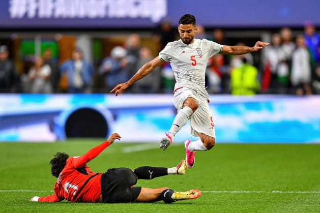June 26, 2026: Iran defender Milad Mohammadi (5) leaps over a tackle attempt by Egypt defender Mohamed Hany (3) during the FIFA World Cup, WM, Weltmeisterschaft, Fussball group stage match between Egypt and Iran in Seattle, WA. The match ended in a 1-1 draw. CSM Seattle United States - ZUMAc04_ 20260626_zma_c04_418 Copyright: xStevexFaberx