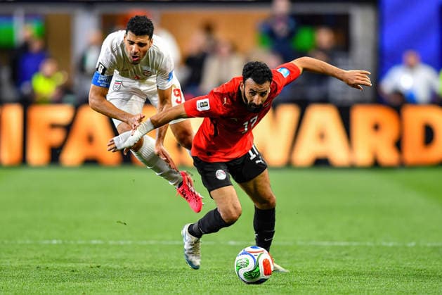 June 26, 2026: Egypt midfielder Mohanad Lasheen (17) moves the ball as Iran forward Mehdi Taremi (9) goes airborne during the FIFA World Cup, WM, Weltmeisterschaft, Fussball group stage match between Egypt and Iran in Seattle, WA. The match ended in a 1-1 draw. CSM Seattle United States - ZUMAc04_ 20260626_zma_c04_427 Copyright: xStevexFaberx