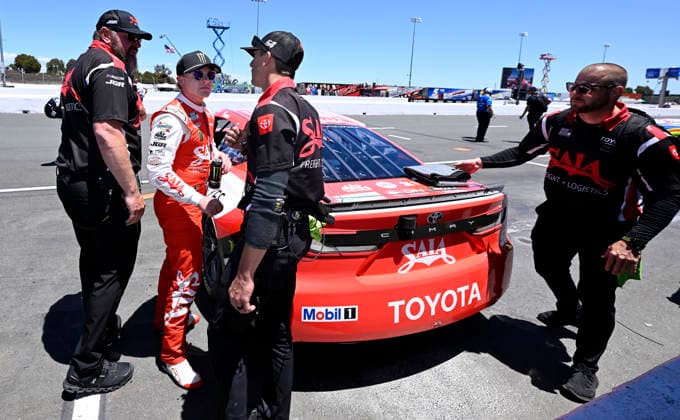 SONOMA, CA - JUNE 27: Ty Gibbs ( 54 Joe Gibbs Racing Saia Freight + Logistics Toyota) is congratulated by a crew member after capturing the pole for the NASCAR, Motorsport, USA Cup Series Toyota Save Mart 350 on June 27, 2026, at Sonoma Raceway in Sonoma, CA. (Photo by Will Lester Icon Sportswire) AUTO: JUN 27 NASCAR Cup Series Toyota Save Mart 350 EDITORIAL USE ONLY Icon26062711942