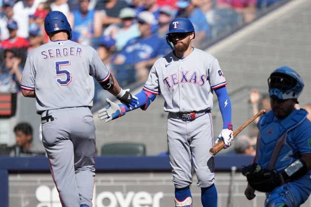 June 27, 2026, Toronto, On, CANADA: Texas Rangers Corey Seager (5) celebrates his solo home run with teammate Brandon Nimmo (24) during sixth inning American League MLB, Baseball Herren, USA baseball action against the Toronto Blue Jays, in Toronto, Saturday, June 27, 2026. Canada News - June 27, 2026  - ZUMAc35_ 20260627_zaf_c35_090 Copyright: xNathanxDenettex
