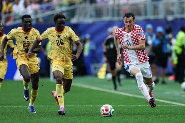 Croatia v Ghana: Group L - FIFA World Cup, WM, Weltmeisterschaft, Fussball 2026 Ante Budimir of Croatia in action against Derrick Luckassen of Gana and Marvin Senaya of Gana during the FIFA World Cup 2026 Group L match between Croatia and Ghana at Philadelphia Stadium on June 27, 2026 in Philadelphia, Pennsylvania.  IgorxKralj PIXSELL