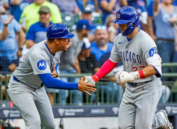 Chicago Cubs designated hitter Seiya Suzuki (R) celebrates with Chicago Cubs third base coach Quintin Berry (L) after hitting a two RBI home run in the fourth inning of the MLB, Baseball Herren, USA game between the Chicago Cubs and the Milwaukee Brewers at American Family Field in Milwaukee, Wisconsin on Saturday, June 27, 2026.  MIL20260627815 TANNENxMAURY
