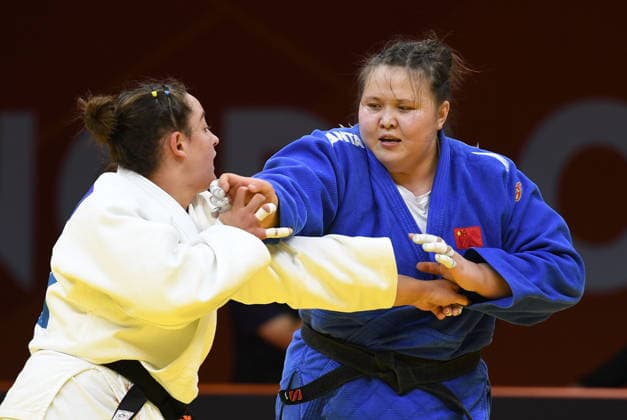 (260628) -- QINGDAO, June 28, 2026 -- Ayiman Jinesinuer (R) of China competes against Yuli Alma Mishiner of Israel during the women s +78kg bronze medal match at the IJF World Judo Tour Qingdao Grand Prix 2026 in Qingdao, east China s Shandong Province, June 28, 2026. ) (SP)CHINA-QINGDAO-JUDO-GRAND PRIX 2026(CN) LixZiheng 