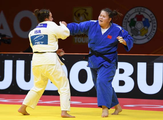 (260628) -- QINGDAO, June 28, 2026 -- Ayiman Jinesinuer (R) of China competes against Yuli Alma Mishiner of Israel during the women s +78kg bronze medal match at the IJF World Judo Tour Qingdao Grand Prix 2026 in Qingdao, east China s Shandong Province, June 28, 2026. ) (SP)CHINA-QINGDAO-JUDO-GRAND PRIX 2026(CN) LixZiheng 