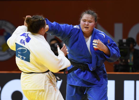 (260628) -- QINGDAO, June 28, 2026 -- Ayiman Jinesinuer (R) of China competes against Yuli Alma Mishiner of Israel during the women s +78kg bronze medal match at the IJF World Judo Tour Qingdao Grand Prix 2026 in Qingdao, east China s Shandong Province, June 28, 2026. ) (SP)CHINA-QINGDAO-JUDO-GRAND PRIX 2026(CN) LixZiheng 