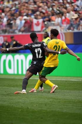 South Africa v Canada - FIFA World Cup, WM, Weltmeisterschaft, Fussball 2026 - Round of 32 INGLEWOOD, CALIFORNIA - JUNE 28: Tani Oluwaseyi (12) of Canada in action against Ime Okon (21) of South Africa during the 2026 FIFA World Cup Round of 32 match between South Africa and Canada at Los Angeles Stadium (SoFi Stadium) in Inglewood, California, United States on June 28, 2026. Tayfun Coskun Anadolu California United States. Editorial use only. Please get in touch for any other usage.  Copyright: x2026xAnadoluxTayfunxCoskunx