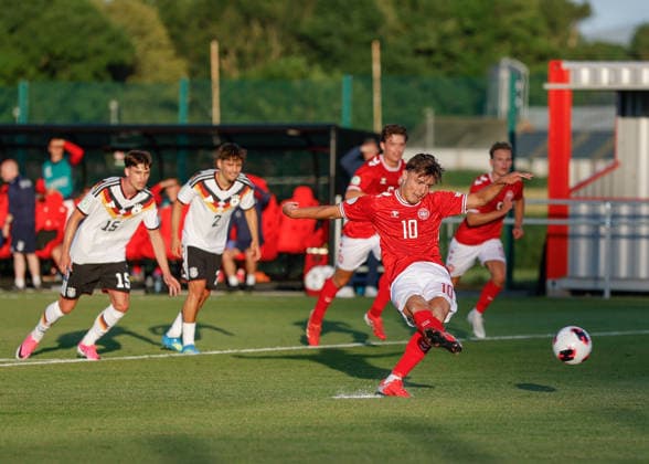 Denbighshire, Wales, 28th June 2026. Olti Hyseni of Denmark scores their sides first goal during the Germany U19 vs Denmark U19 UEFA European U19 Championship match at Central Park, Denbighshire. Picture credit should read: Cody Froggatt Sportimage EDITORIAL USE ONLY. No use with unauthorised audio, video, data, fixture lists, club league logos or live services. Online in-match use limited to 120 images, no video emulation. No use in betting, games or single club league player publications. SPI_22_CF_GERMANY_U19_V_DENMARK_U19 SPI-4848-0022