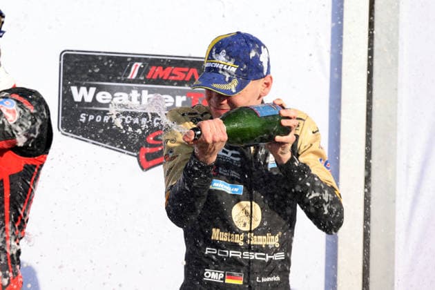 Dritter Laurin Heinrich (GER) Porsche 963 83 vom JDC Miller Motorsport Team bei der Champagnerdusche auf dem Podium, 6 Stunden Watkins Glen, IMSA Rennserie, 28.06.2026, Staat New York, USA, GTP Klasse, *** Laurin Heinrich of Germany, driving the No. 83 Porsche 963 for the JDC Miller Motorsport Team, receives a champagne shower on the podium after finishing third in the 6 Hours of Watkins Glen, IMSA Series, June 28, 2026, New York State, USA, GTP class,