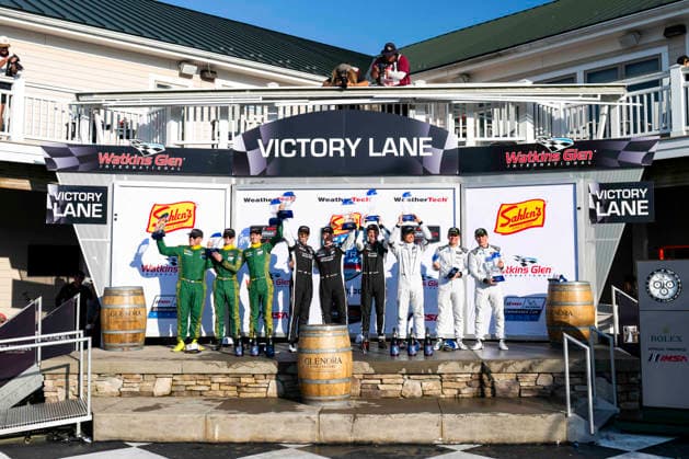 AUTO - 6 HOURS OF THE GLEN 2026 120 ADELSON Adam (usa), ILOTT Callum (gbr), SARGENT Tom (aus), Wright Motorsports, Porsche 911 GT3 R (992.2), 912 HARDWICK Ryan (usa), PERA Riccardo (ita), SCHURING Morris (nld), Manthey 1st Phorm, Porsche 911 GT3 R (992.2), 068 HASSE CLOT Valentin (fra), ESTEP Trenton (usa), FOSSARD Marius (fra), Car Blanche, Aston Martin GT3 Evo, podium during the Six Hours of the Glen 2026, 6th round of the 2026 IMSA WeatherTech SportsCar Championship, from June 26 to 28 on the Watkins Glen International in Watkins Glen, New York, United States of America - Watkins GlenUnited States  Copyright: xFabrizioxBoldonix