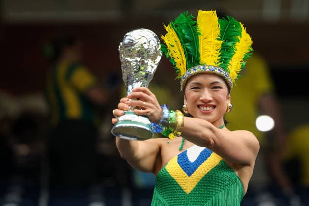 HOUSTON, TX - JUNE 29: A Brazil fan wears a team color headdress and crocheted shirt as she holds a World Cup trophy ahead of the FIFA World Cup, WM, Weltmeisterschaft, Fussball 2026 Round of 32 match between Brazil and Japan on June 29, 2026, at Houston Stadium in Houston, Texas. (Photo by David Buono Icon Sportswire) SOCCER: JUN 29 FIFA World Cup 26 Round of 32 - Brazil vs Japan EDITORIAL USE ONLY Icon260629005