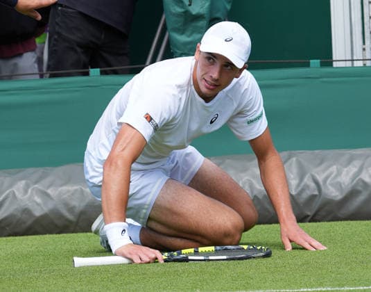 Tennis - 2026 Wimbledon Championships - Day One (Week One) - All England Lawn Tennis & Croquet Club, London - Monday 29th June 2026 Men™s Singles, First Round: Arthur Rinderknech (FRA) vs. Oliver Tarvet (GBR) Oliver Tarvet fafter falling over at the net COLORSPORT ANDREW COWIE 
