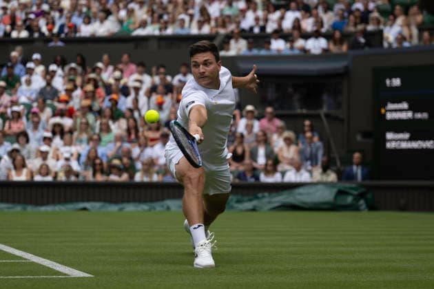RECORD DATE NOT STATED 29th June 2026; All England Lawn Tennis and Croquet Club, London, England; Wimbledon Tennis Tournament, Day One; Miomir Kecmanovic (SRB) plays a backhand in his first round match against Jannik Sinner (ITA) GodfreyxPitt