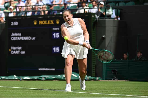 RECORD DATE NOT STATED 29th June 2026; All England Lawn Tennis and Croquet Club, London, England; Wimbledon Tennis Tournament, Day One; Jelena Ostapenko (LAT) plays a backhand in her first round match against Harriet Dart (GBR) GodfreyxPitt
