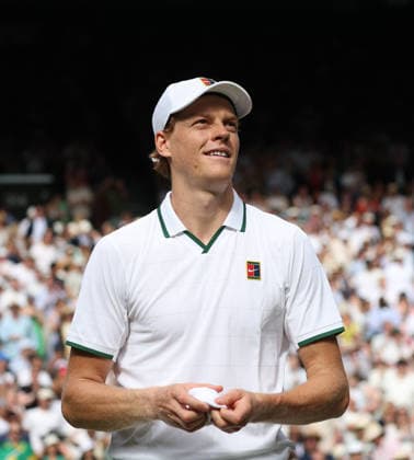 Italy s Jannik Sinner smiles after winning his match against Serbian Miomir Kecmanovic on day one of the 2026 Wimbledon Championships in London on Monday, June 29, 2026.  LON2026062942 HUGOxPHILPOTT