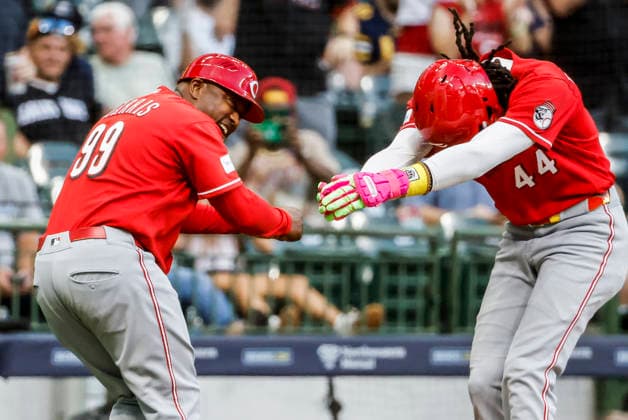 Cincinnati Reds designated hitter Elly de la Cruz (R) celebrates with Cincinnati Reds third base coach Willie Harris after hitting a two RBI home run in the fifth inning of the MLB, Baseball Herren, USA game between the Cincinnati Reds and the Milwaukee Brewers at American Family Field in Milwaukee, Wisconsin on Monday, June 29, 2026.  MIL20260629827 TANNENxMAURY
