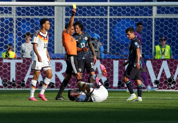 (260630) -- BOSTON, June 30, 2026 -- Referee shows a yellow card to Andres Cubas (1st R) during the round of 32 match between Germany and Paraguay at the 2026 FIFA World Cup, WM, Weltmeisterschaft, Fussball at Boston Stadium in Boston, the United States, June 29, 2026. ) (SP)U.S.-BOSTON-FOOTBALL-FIFA WORLD CUP-ROUND OF 32-GER VS PRY ChenxYichen 