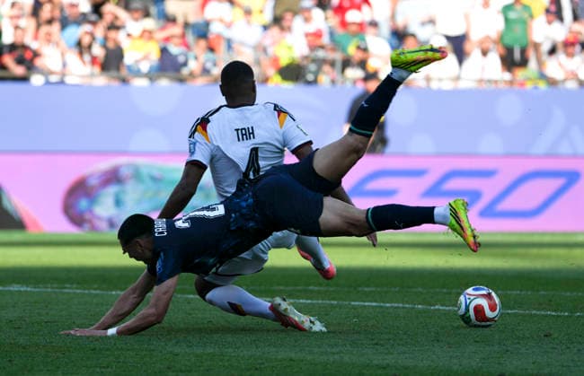 (260630) -- BOSTON, June 30, 2026 -- Gustavo Caballero (bottom) of Paraguay vies with Jonathan Tah (top) of Germany during the round of 32 match between Germany and Paraguay at the 2026 FIFA World Cup, WM, Weltmeisterschaft, Fussball at Boston Stadium in Boston, the United States, June 29, 2026. ) (SP)U.S.-BOSTON-FOOTBALL-FIFA WORLD CUP-ROUND OF 32-GER VS PRY ChenxYichen 