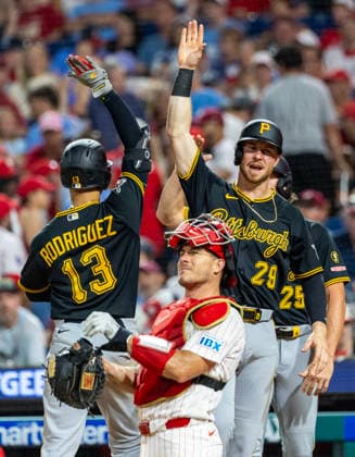 Pittsburgh Pirates Endy Rodríguez (13) celebrates his three run homer with Ryan O Hearn (29) behind Philadelphia Phillies catcher J.T. Realmuto in the ninth inning on Monday, June 29, 2026, in Philadelphia.  PHI20260629013 LaurencexKesterson
