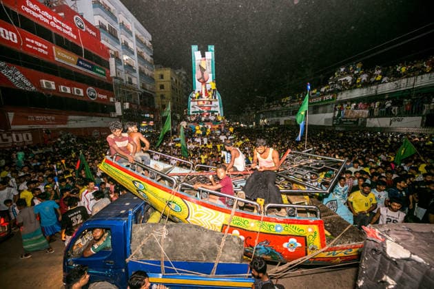 June 30, 2026, Munshiganj, Bangladesh: Thousands of Brazilian football supporters flood the Supermarket Chottor, as Brazil secured a 2-1 victory over Japan in the FIFA World Cup, WM, Weltmeisterschaft, Fussball 2026 group stage. Despite heavy rain, the crowd - draped in yellow jerseys and waving green-and-gold flags - packed every inch of the square, climbing monument structures and rooftops to catch a glimpse of the giant screen. Dhaka Bangladesh - ZUMAa259 0860352465st Copyright: xRayhanxAhmedx