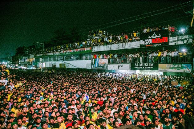 June 30, 2026, Munshiganj, Bangladesh: Thousands of Brazilian football supporters flood the Supermarket Chottor, as Brazil secured a 2-1 victory over Japan in the FIFA World Cup, WM, Weltmeisterschaft, Fussball 2026 group stage. Despite heavy rain, the crowd - draped in yellow jerseys and waving green-and-gold flags - packed every inch of the square, climbing monument structures and rooftops to catch a glimpse of the giant screen. Dhaka Bangladesh - ZUMAa259 0860352478st Copyright: xRayhanxAhmedx