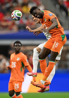 (260701) -- DALLAS, July 1, 2026 -- Ibrahim Sangare (up R) of Cote d Ivoire competes during the round of 32 match between Cote d Ivoire and Norway at the 2026 FIFA World Cup, WM, Weltmeisterschaft, Fussball at Dallas Stadium in Dallas, the United States, June 30, 2026. ) (SP)U.S.-DALLAS-FOOTBALL-FIFA WORLD CUP-ROUND OF 32-CIV VS NOR ChengxMin 