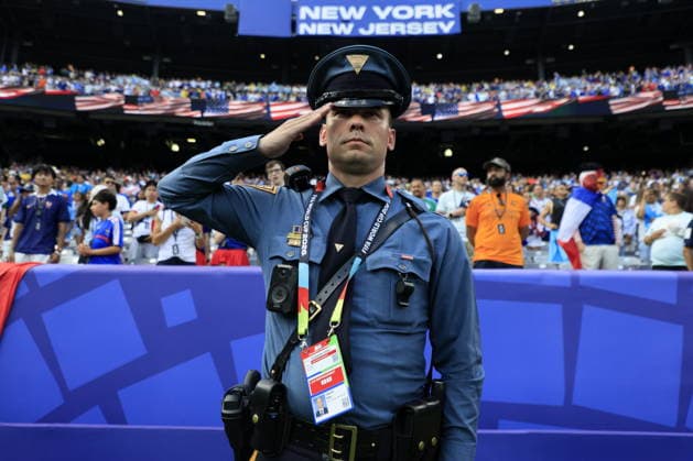 FIFA World Cup, WM, Weltmeisterschaft, Fussball 2026 - Round of 32 - France vs Sweden A New Jersey state police officer salutes ahead of the FIFA World Cup 2026 Round of 32 match France against Sweden, in East Rutherford, New Jersey, USA, 30 June 2026. EAST RUTHERFORD United States  Copyright: xSHAWNxTHEWx