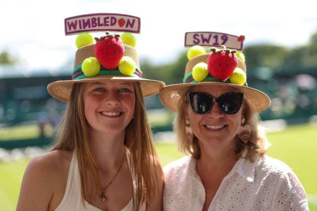 Attendees wear strawberry tennis hats ahead of Day 3 Wimbledon Tennis Championships, Day 3, The All England Lawn Tennis and Croquet Club, London, UK - 01 Jul 2026London The All England Lawn Tennis and United Kingdom  Copyright: xKieranxMcManus Shutterstockx 16970334a