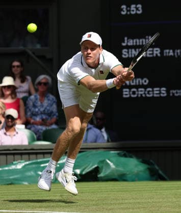 Italian Jannik Sinner plays a backhand in his match against Portugal s Nuno Borges on day three of the 2026 Wimbledon Championships in London on Wednesday, June 01, 2026. Sinner won the match 7-6,7-6,6-4.  LON2026070142 HUGOxPHILPOTT