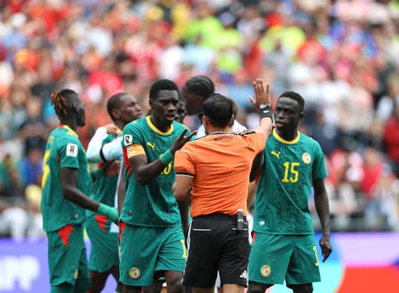 (260702) -- SEATTLE, July 2, 2026 -- Senegal s players surround referee Said Martinez (2nd R) during the round of 32 match between Belgium and Senegal at the 2026 FIFA World Cup, WM, Weltmeisterschaft, Fussball at Seattle Stadium in Seattle, the United States, July 1, 2026. ) (SP)U.S.-SEATTLE-FOOTBALL-FIFA WORLD CUP-ROUND OF 32-BEL VS SEN BaixXuefei 