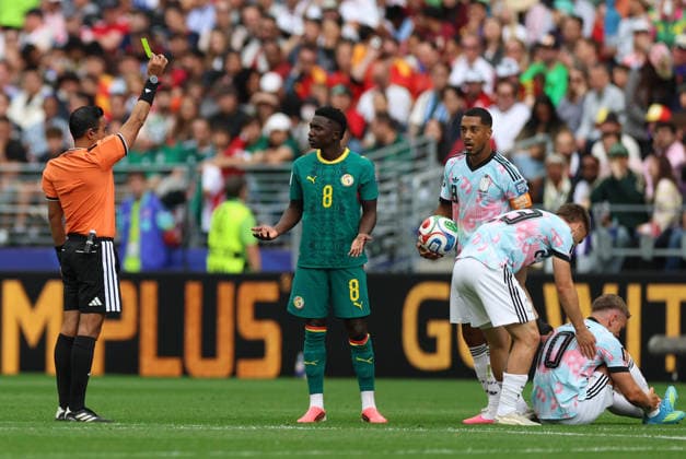 (260702) -- SEATTLE, July 2, 2026 -- Referee Said Martinez (1st L) shows a yellow card to Lamine Camara (2nd L) of Senegal during the round of 32 match between Belgium and Senegal at the 2026 FIFA World Cup, WM, Weltmeisterschaft, Fussball at Seattle Stadium in Seattle, the United States, July 1, 2026. ) (SP)U.S.-SEATTLE-FOOTBALL-FIFA WORLD CUP-ROUND OF 32-BEL VS SEN MaoxSiqian 