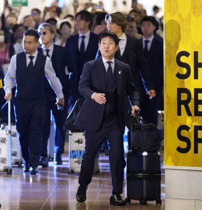 Football: 2026 World Cup Japan men s football team head coach Hajime Moriyasu (front) and his players arrive at Haneda airport in Tokyo on July 2, 2026, after competing in the World Cup finals where they were defeated by Brazil in a round of 32 match.  A14AA0005621215P