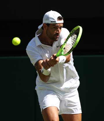 Italian Matteo Berrettini plays a forehand in his match against France s Arthur Fils at Wimbledon on day four of the 2026 Wimbledon Championships in London on Wednesday, June 02, 2026.  LON2026070239 HUGOxPHILPOTT
