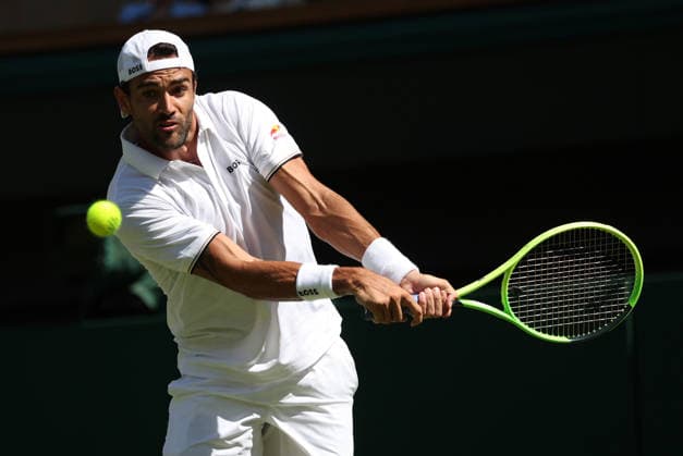 Italian Matteo Berrettini plays a forehand in his match against France s Arthur Fils at Wimbledon on day four of the 2026 Wimbledon Championships in London on Thursday, July 2, 2026.  LON20260702229 HUGOxPHILPOTT