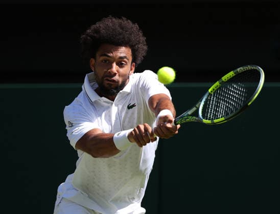 France s Arthur Fils plays a backhand in his match against Italian Matteo Berrettini at Wimbledon on day four of the 2026 Wimbledon Championships in London on Thursday, July 2, 2026.  LON20260702241 HUGOxPHILPOTT