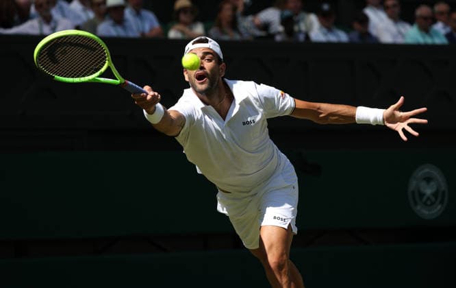 Italian Matteo Berrettini plays a forehand in his match against France s Arthur Fils at Wimbledon on day four of the 2026 Wimbledon Championships in London on Thursday, July 2, 2026.  LON2026070242 HUGOxPHILPOTT