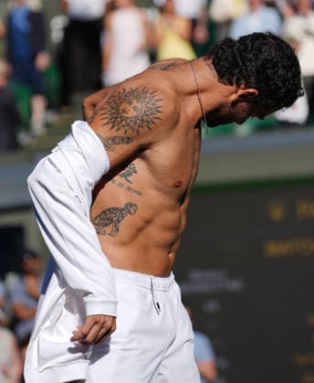 Tennis - 2026 Wimbledon Championships - Day Four (Week One) - All England Lawn Tennis & Croquet Club, London - Thursday 2nd July 2026 Men™s Singles, Second Round: Matteo Berrettini (ITA) vs. Arthur Fils (FRA) Matteo Berrettini shows off his tattoos after the match COLORSPORT ANDREW COWIE 