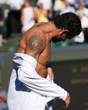 Tennis - 2026 Wimbledon Championships - Day Four (Week One) - All England Lawn Tennis & Croquet Club, London - Thursday 2nd July 2026 Men™s Singles, Second Round: Matteo Berrettini (ITA) vs. Arthur Fils (FRA) Matteo Berrettini shows off his tattoos after the match COLORSPORT ANDREW COWIE 