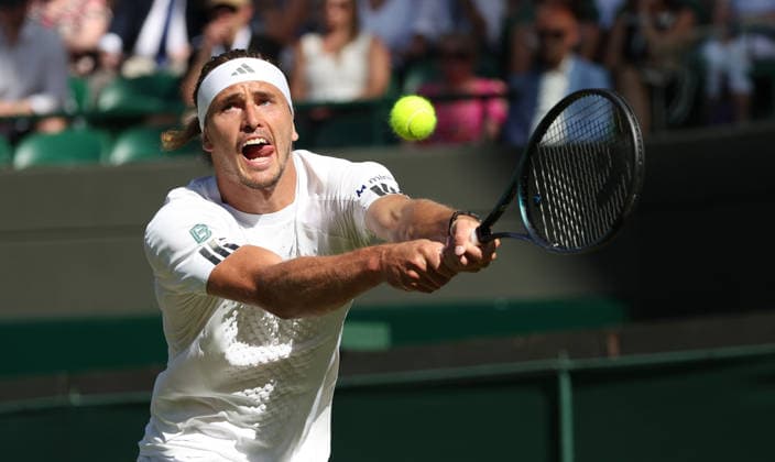 Germany s Alexander Zverev plays a backhand in his match against France s Valentin Royer at Wimbledon on day four of the 2026 Wimbledon Championships in London on Thursday, July 02, 2026. Zverev won the match 6-1,6-3,7-6.  LON2026070263 HUGOxPHILPOTT
