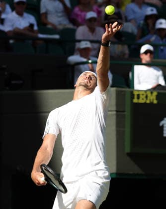 Germany s Alexander Zverev serves in his match against France s Valentin Royer at Wimbledon on day four of the 2026 Wimbledon Championships in London on Thursday, July 02, 2026. Zverev won the match 6-1,6-3,7-6.  LON2026070264 HUGOxPHILPOTT