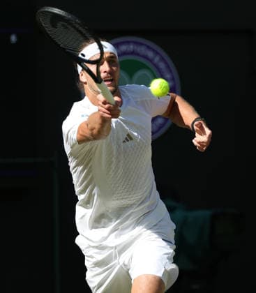 Germany s Alexander Zverev plays a forehand in his match against France s Valentin Royer at Wimbledon on day four of the 2026 Wimbledon Championships in London on Thursday, July 02, 2026. Zverev won the match 6-1,6-3,7-6.  LON2026070266 HUGOxPHILPOTT