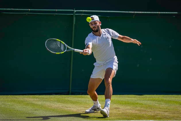 RECORD DATE NOT STATED 2nd July 2026; All England Lawn Tennis and Croquet Club, London, England; Wimbledon Tennis Tournament, Day Four; Jacob Fearnley (GBR) plays a forehand in his second round match against Jaume Munar (ESP) GodfreyxPitt