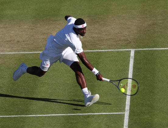 American Frances Tiafoe runs for the ball in his match against Britain s Jan Choinski at Wimbledon on day four of the 2026 Wimbledon Championships in London on Thursday, July 02, 2026.  LON2026070276 HUGOxPHILPOTT