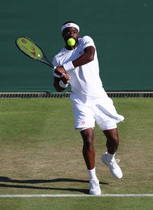 American Frances Tiafoe plays a backhand in his match against Britain s Jan Choinski at Wimbledon on day four of the 2026 Wimbledon Championships in London on Thursday, July 02, 2026.  LON2026070284 HUGOxPHILPOTT