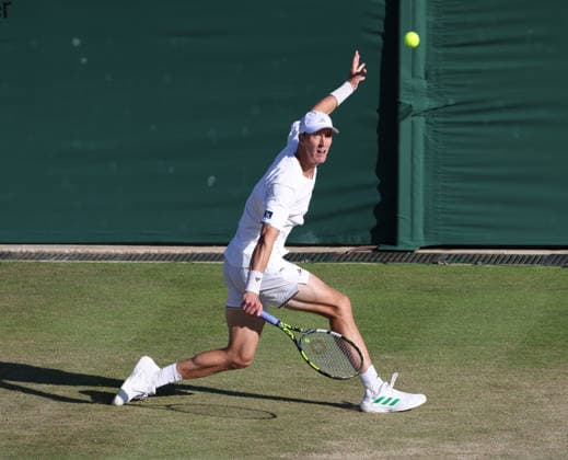 Britain s Jan Choinski plays a backhand in his match against American Frances Tiafoe at Wimbledon on day four of the 2026 Wimbledon Championships in London on Thursday, July 02, 2026.  LON2026070279 HUGOxPHILPOTT