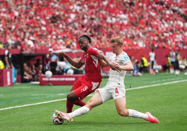 June 24, 2026, Vancouver, Bc, CANADA: Canada s Luc de Fougerolles (4) takes the ball away from Switzerland s Johan Manzambi (9) during the first half of a World Cup Group B soccer match, in Vancouver, on Wednesday, June 24, 2026. Canada News - June 24, 2026  - ZUMAc35_ 20260624_zaf_c35_351 Copyright: xDarrylxDyckx