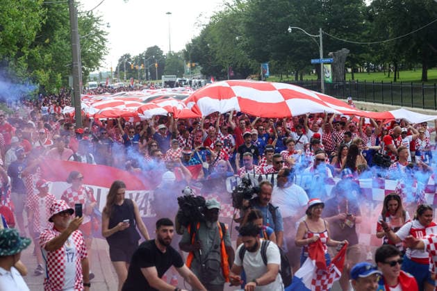 Portugal v Croatia: Round Of 32 - FIFA World Cup, WM, Weltmeisterschaft, Fussball 2026 Thousands of Croatian fans carry a large Croatian flag during a Croatian parade ahead of the FIFA World Cup 2026 Round Of 32 match between Portugal and Croatia at Toronto Stadium on July 2, 2026 in Toronto, Canada.  SanjinxStrukic PIXSELL